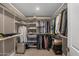 Spacious walk-in closet featuring custom shelving and ample storage for clothing and accessories at 8343 E Quarterhorse Trl, Scottsdale, AZ 85258