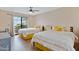 Inviting bedroom featuring two beds with a view of the covered patio and outdoor seating at 848 E Morningside Dr, Phoenix, AZ 85022