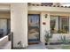 Front door featuring a security screen door, updated hardware, and desert landscaping at 848 E Morningside Dr, Phoenix, AZ 85022