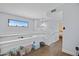 Bright upstairs hallway with hardwood floors, a window with a view, and access to the bedrooms at 848 E Morningside Dr, Phoenix, AZ 85022