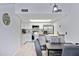 Bright kitchen featuring white cabinets, stainless steel appliances, and an adjacent dining area at 848 E Morningside Dr, Phoenix, AZ 85022