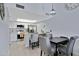 Modern kitchen with stainless steel appliances, breakfast bar, and dining area at 848 E Morningside Dr, Phoenix, AZ 85022