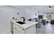 Open concept kitchen area with breakfast bar flowing into the living room at 848 E Morningside Dr, Phoenix, AZ 85022