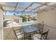 Cozy covered patio offers a view of the community pool and seating, perfect for relaxation at 848 E Morningside Dr, Phoenix, AZ 85022