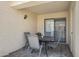 Cozy covered patio with outdoor seating, table, and a sliding door to the interior at 848 E Morningside Dr, Phoenix, AZ 85022