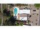 An aerial view of the property, featuring a pool, landscaping, and ample parking at 10232 N 86Th St, Scottsdale, AZ 85258