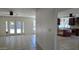 Bright living room with ceiling fan, tile floors, and easy access to the kitchen and backyard at 10232 N 86Th St, Scottsdale, AZ 85258