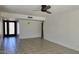 Large living room with tile flooring and natural light, ready for personal touches at 10232 N 86Th St, Scottsdale, AZ 85258
