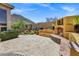 Expansive backyard with a fireplace, mature trees, and lush landscaping, offering a serene retreat at 10310 N 135Th Way, Scottsdale, AZ 85259