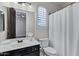 Light-filled bathroom featuring bright window and door access to adjoining bedroom at 10310 N 135Th Way, Scottsdale, AZ 85259