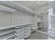 A walk-in closet with white shelving and drawers offers ample storage space at 10310 N 135Th Way, Scottsdale, AZ 85259