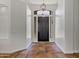 Welcoming foyer features tiled floors and a decorative light fixture at 10310 N 135Th Way, Scottsdale, AZ 85259