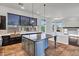 Open kitchen showcasing a sizable center island, ample counter space, and decorative pendant lighting at 10310 N 135Th Way, Scottsdale, AZ 85259