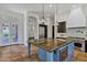 Open-concept kitchen design featuring a large island, stainless appliances, and custom cabinetry at 10310 N 135Th Way, Scottsdale, AZ 85259