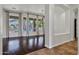 Bright living area with hardwood floors, large windows, and views of the backyard pool at 10310 N 135Th Way, Scottsdale, AZ 85259