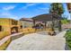 Beautiful outdoor area with a cozy fireplace, built-in BBQ, and lush greenery, great for entertaining at 10310 N 135Th Way, Scottsdale, AZ 85259
