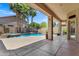 Relaxing outdoor area with covered patio overlooking the pool and spa at 10310 N 135Th Way, Scottsdale, AZ 85259