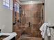 Modern bathroom featuring tile shower with glass door and stylish fixtures at 10310 N 135Th Way, Scottsdale, AZ 85259