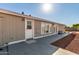 A patio and back door in the backyard of the home with lots of sunlight and windows at 10618 W Prairie Ln, Casa Grande, AZ 85193