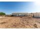 A large, private lot features a home, outbuildings and ample space for activities or expansion at 10618 W Prairie Ln, Casa Grande, AZ 85193