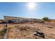 Expansive backyard view shows the property's generous space, storage shed, and potential for outdoor activities at 10618 W Prairie Ln, Casa Grande, AZ 85193