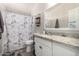 Bathroom featuring a shower and tub combination, granite counters, and tile backsplash at 10618 W Prairie Ln, Casa Grande, AZ 85193