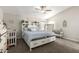 Bright bedroom with a vaulted ceiling, white trim, and neutral decor and carpet at 10618 W Prairie Ln, Casa Grande, AZ 85193