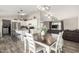 Open-concept dining room flowing into the kitchen and living area, perfect for entertaining and gatherings at 10618 W Prairie Ln, Casa Grande, AZ 85193
