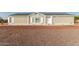 Charming single-story home featuring gravel landscaping, a welcoming covered porch, and curb appeal at 10618 W Prairie Ln, Casa Grande, AZ 85193