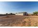 Expansive lot showcases a cozy single-story home and gravel landscaping, offering a tranquil retreat at 10618 W Prairie Ln, Casa Grande, AZ 85193