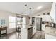 Bright kitchen features stainless steel appliances, granite counters, and wood-look floors at 10618 W Prairie Ln, Casa Grande, AZ 85193