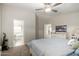 Main bedroom with a glimpse of a bathroom, carpet and light color scheme at 10618 W Prairie Ln, Casa Grande, AZ 85193