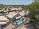 Backyard aerial view of a home with a pool, patio, and a tiled roof, showing outdoor amenities at 12042 S 44Th St, Phoenix, AZ 85044