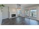 Bonus room with natural lighting, decorative fireplace, and view of backyard at 12042 S 44Th St, Phoenix, AZ 85044