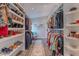 A walk-in closet filled with clothing and shoes, offering ample storage space at 12042 S 44Th St, Phoenix, AZ 85044