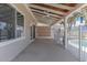 Spacious covered patio with ceiling fans, ideal for outdoor relaxation and entertaining by the pool at 12042 S 44Th St, Phoenix, AZ 85044