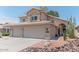 Charming two-story home with a three car garage, desert landscaping, and a tile roof at 12042 S 44Th St, Phoenix, AZ 85044