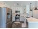 Modern kitchen featuring stainless steel appliances, white cabinets, and quartz countertops at 12042 S 44Th St, Phoenix, AZ 85044