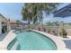 Inviting pool area with lush landscaping and patio umbrellas for a refreshing outdoor experience at 12042 S 44Th St, Phoenix, AZ 85044