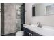 Modern bathroom with a glass-enclosed shower, sleek vanity, and stylish fixtures at 12431 N 30Th Ave, Phoenix, AZ 85029