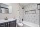 Well-designed bathroom with geometric tiles, modern fixtures, and a bathtub and shower combination at 12431 N 30Th Ave, Phoenix, AZ 85029