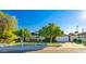 Charming single-story home featuring a well-manicured lawn, mature trees, and a cozy, inviting exterior at 12431 N 30Th Ave, Phoenix, AZ 85029
