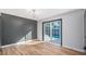 Bright living room with hardwood floors and sliding glass doors leading to the backyard and pool at 12431 N 30Th Ave, Phoenix, AZ 85029