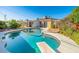 Backyard pool offers a refreshing escape with a diving board and surrounding patio space for entertaining at 12431 N 30Th Ave, Phoenix, AZ 85029