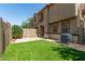 A low-maintenance backyard includes a green artificial turf lawn and block fence at 1255 S Rialto -- # 115, Mesa, AZ 85209