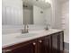 Bright bathroom with double sinks, dark cabinetry, a shower-tub combination, and recessed lighting at 1255 S Rialto -- # 115, Mesa, AZ 85209