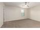 Spacious bedroom with a neutral color scheme, ceiling fan, and a window providing natural light at 1255 S Rialto -- # 115, Mesa, AZ 85209