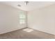 A bedroom featuring neutral colored carpeting, a ceiling fan, and a window at 1255 S Rialto -- # 115, Mesa, AZ 85209