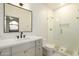 Bathroom featuring a glass shower, white cabinets, quartz counters and modern fixtures at 12776 N 78Th St, Scottsdale, AZ 85260