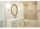 Bathroom featuring dual sinks, quartz counters, tiled shower, and a soaking tub at 12776 N 78Th St, Scottsdale, AZ 85260